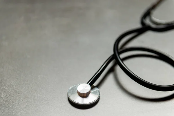 Stethoscope on concrete. Heart check or health check concept.