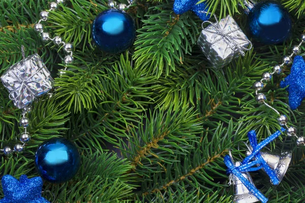 Christmas branch with blue decorations — Stock Photo, Image