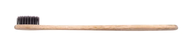 Натуральная деревянная зубная щетка — стоковое фото