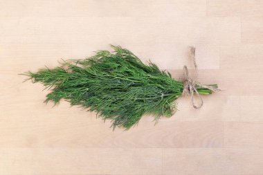 A bunch of dill tied with a rope