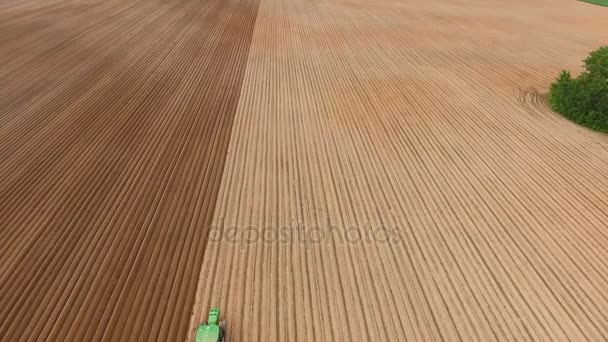 Farmer seeding, sowing crops at field.Aerial view. — Stock Video