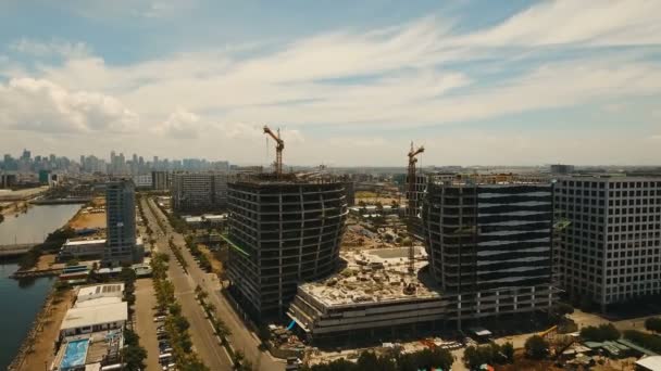 Building under construction with cranes in the city. Philippines, Manila, Makati. — Stock Video