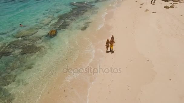 Family with child on the beach. — Stock Video