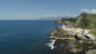 Kapurpurawan Rock Formation in Ilocos Norte Philippines clipart