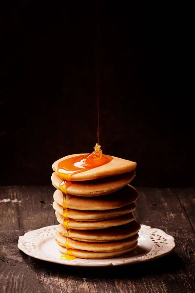 Pancakes on Rustic Wooden Board