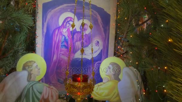 Camera Moving Away From Saint Mary Icon in a Fir Tree, Installed Inside of Orthodox Cathedral on New Year`s Eve in Kiev — Stock Video