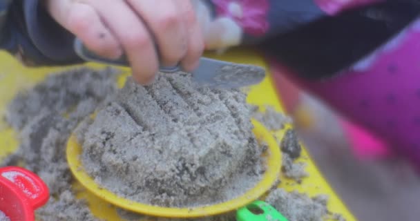 Child 's Hands Making a Dish — стоковое видео