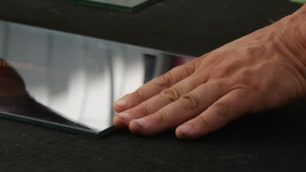 In a Laboratory of Glass Control Some Specialist Move a Mirror Looking Glass Sheet on a Black Table — Stock Video