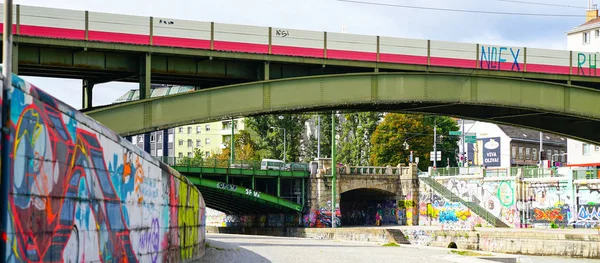 Graffiti vandalism on walls constructed along River Danube. — Stock Photo, Image