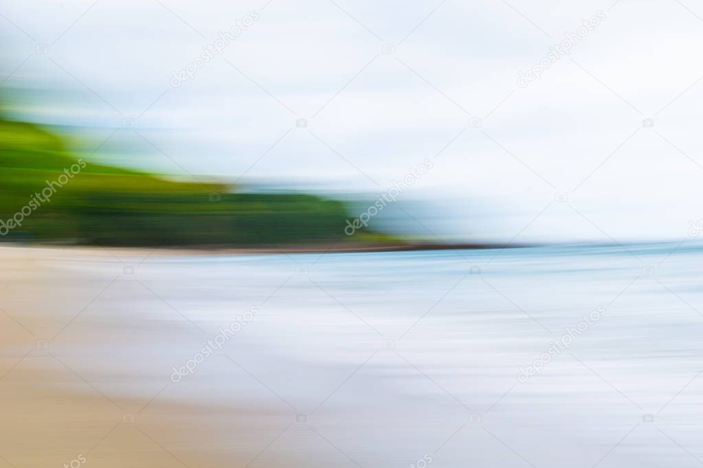 Coastal motion blur abstract with sun  shimmer across sea