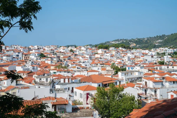 Orange roof tops and whitwashed walls of Skiathos town from top