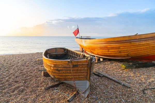Two varnished clinker boats pulled up on beach — 스톡 사진