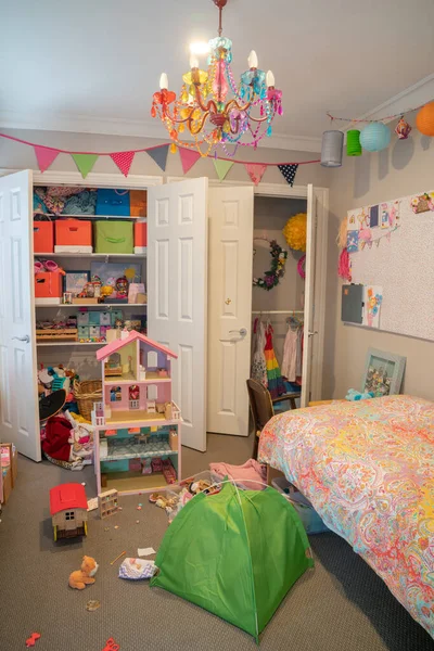 Inside a messy but well used small girl's bedroom. — 스톡 사진