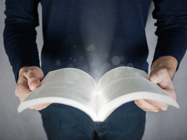 Magic effect on book opening top view, education and reading concept — Stock Photo, Image