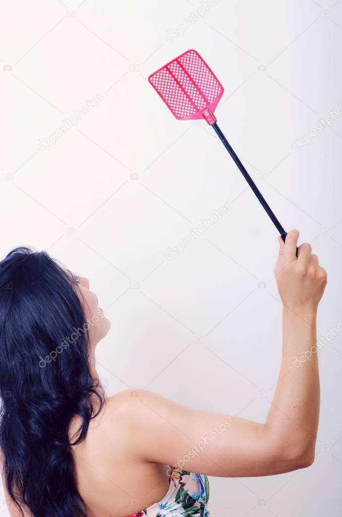 girl with a fly swatter