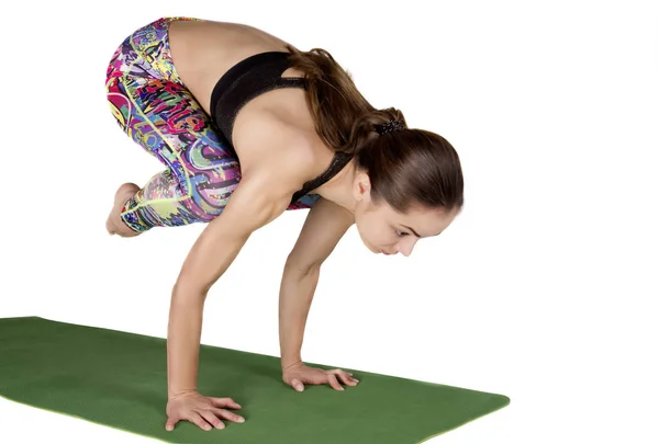 Athletic young woman practicing yoga pose isolated on white back — Stock Photo, Image