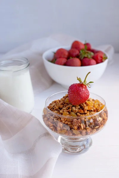 Homemade granola in jar on rustic kitchen table, healthy breakfa Royalty Free Stock Photos