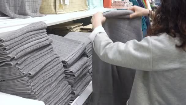 MOSCOW, RUSSIA, MAY 20, 2016: Woman Choosing Grey Terry Towel In Department Store — Stock Video