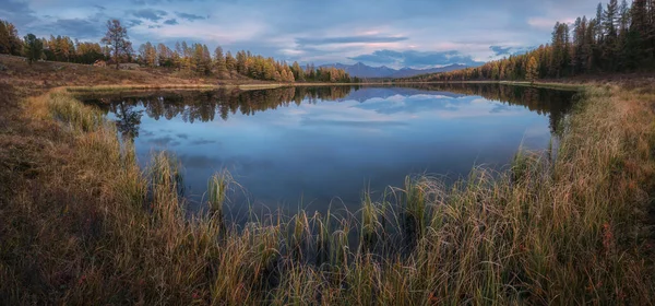 Mirror Surface Wide Angle Breathtaking Lake Autumn Landscape With Mountain Range On Background