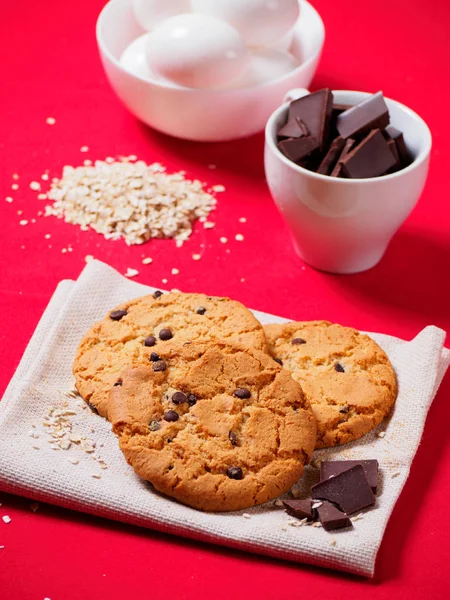 Round cookies with chocolate on the red table