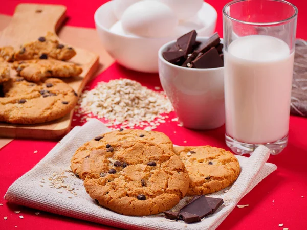 Round cookies with chocolate on the red table