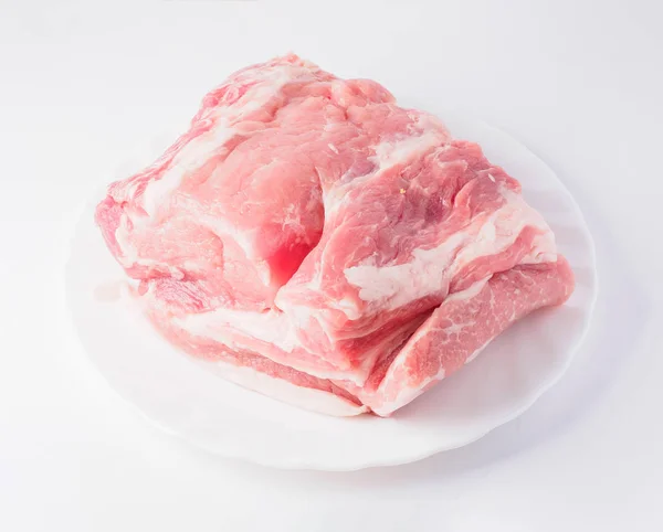 Raw piece of meat on plate — Stock Photo, Image