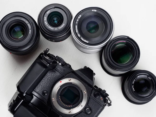 Equipment of photographer on white table