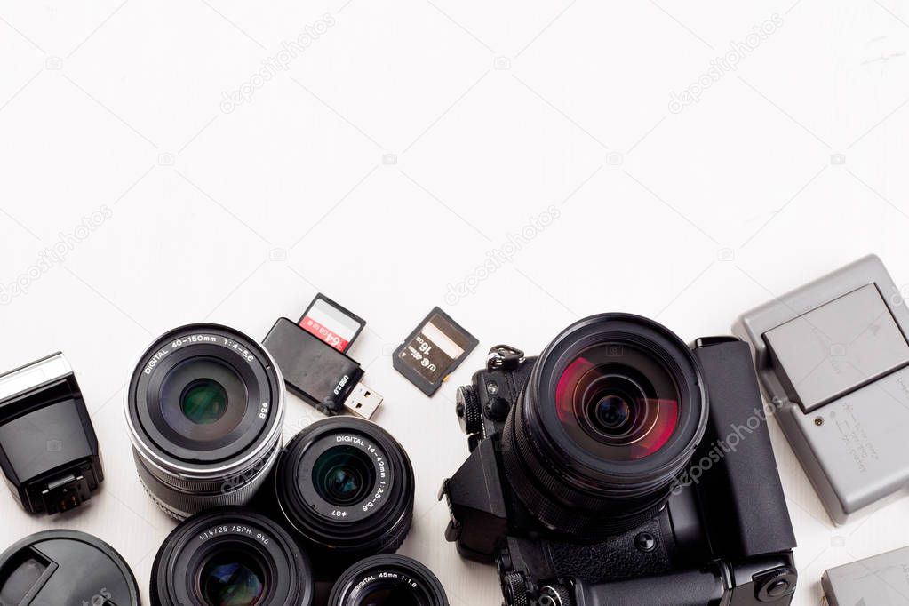 Equipment of photographer on white table