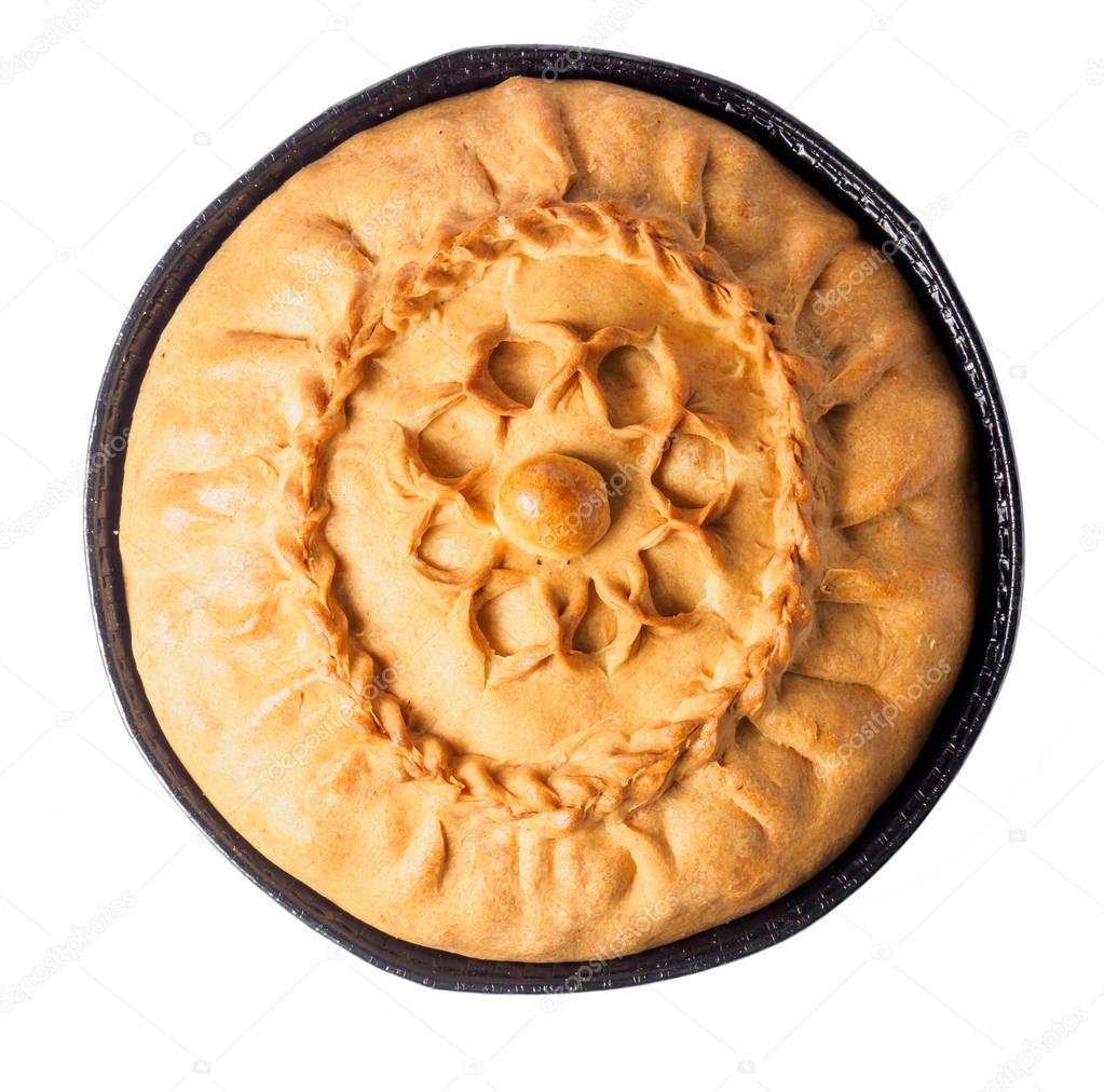 Tatar round pie on the table with napkin
