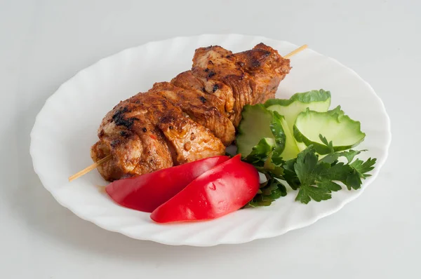 Beef pork barbecue kebab on skewer on a white plate — Stock Photo, Image