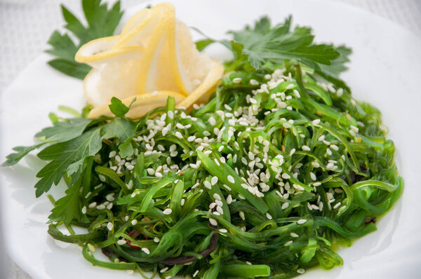 Chuka green salad with lemon and greens