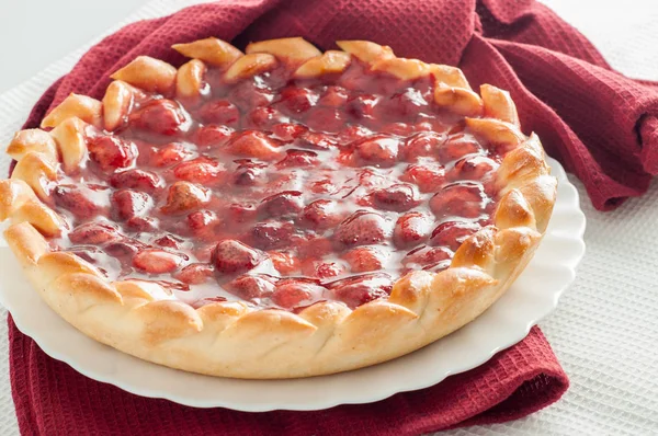 Berry sweet round pie on a table napkin — Stock Photo, Image