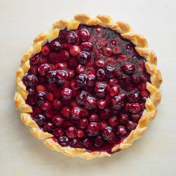 Berry sweet round pie on a table napkin — Stock Photo, Image