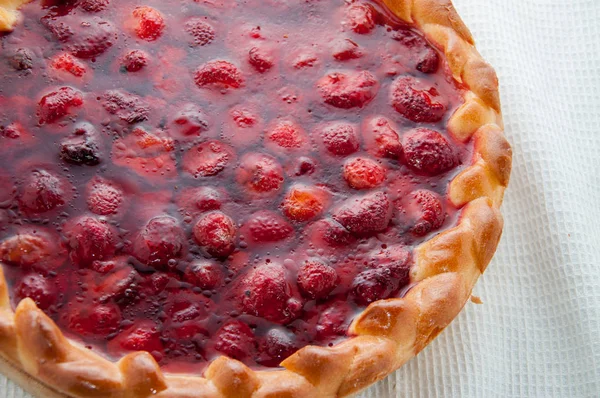 Berry sweet round pie on a table napkin — Stock Photo, Image