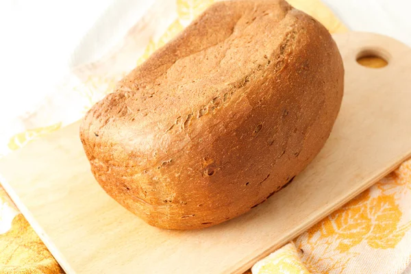 Loaf of white bread on a table — Stock Photo, Image