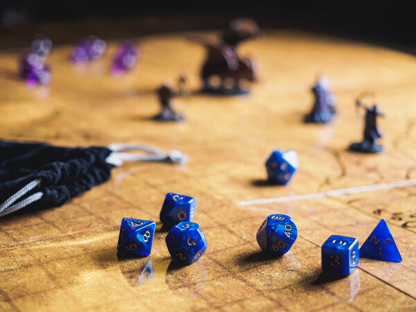 Roleplay game with dragons in dungeon. Yellow field dice