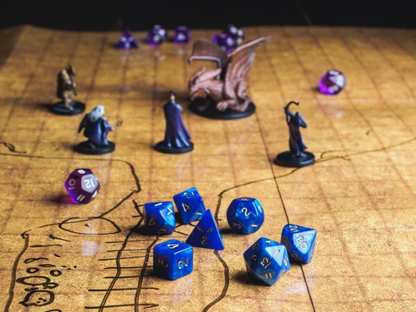 Roleplay game with dragons in dungeon. Yellow field dice — Stock Photo, Image