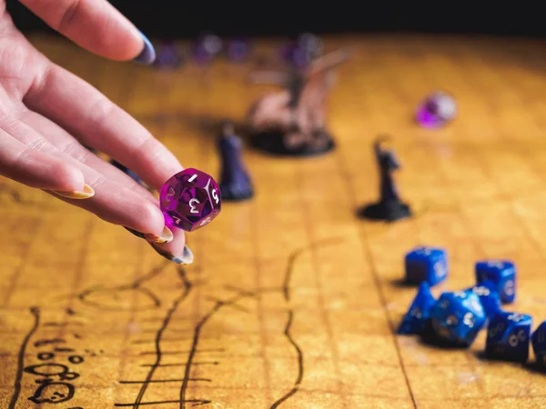 Roleplay game with dragons in dungeon. Yellow field dice — Stock Photo, Image