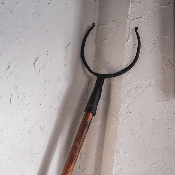 Old oven fork tongs with wooden handle for pot — Stock Photo, Image