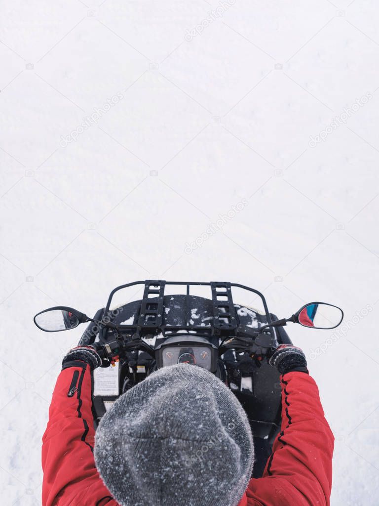 Man in atv quad bike. Winter snow field