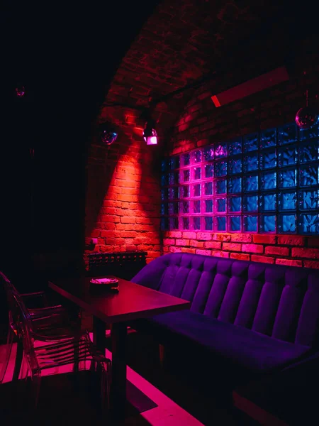 Old loft brick night club with neon lights