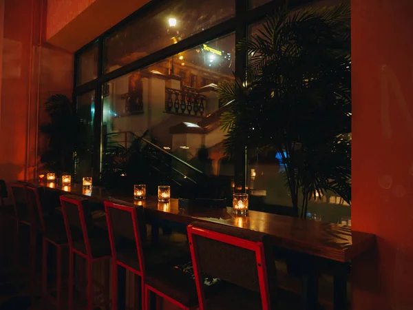 Interior of mexican cantina bar with dim lights and candles — Stock Photo, Image