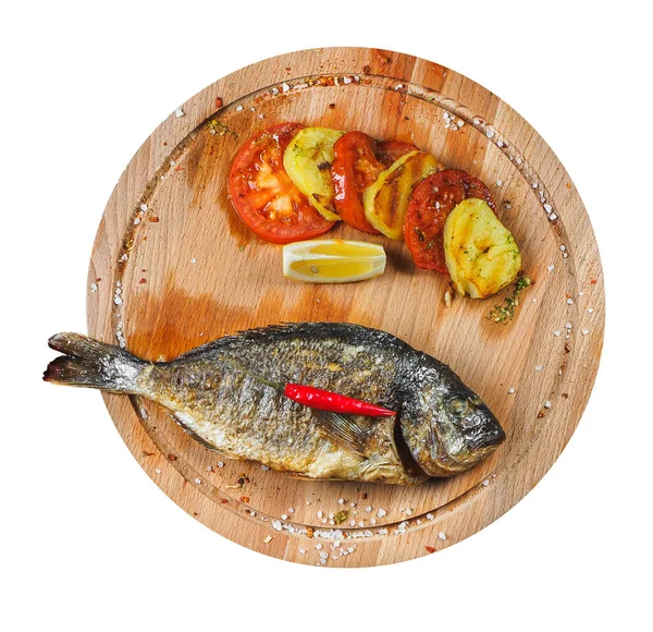 Grilled dorado fish with vegetables on the wooden desk — 스톡 사진