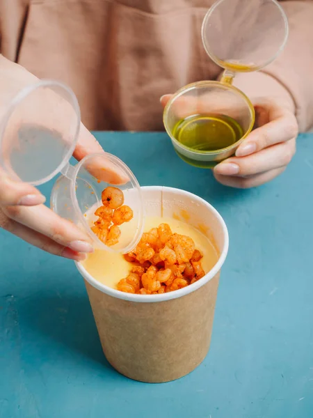 Making of corn soup with fried shrimps. Female hands. — Stock Image Making Corn Soup Fried Shrimps Female Hands Stock Photo