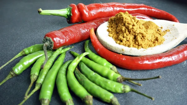 Asian cuisine ingredients - red pepper  green pepper and turmeri — Stock Photo, Image