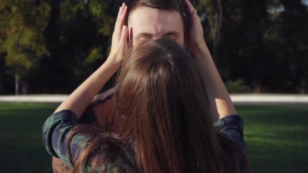 Happy young couple at the park hugging and caress each other — Stock Video