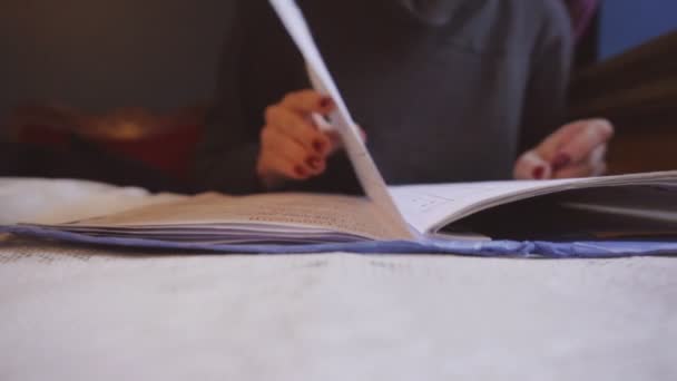 Woman is looking through the menu at the restaurant — Stock Video