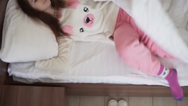 Brunette woman waking up and getting out of her bed — Stock Video