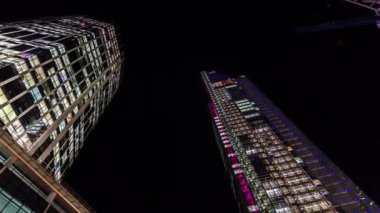 Time lapse view of the famous buildings in the Financial district of the City of London: Heron Tower, 99 Bishopsgate, LLoyds building at night.