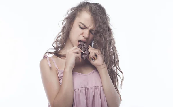 Portrait of a beautiful Woman eating chocolate. — Stock Photo, Image